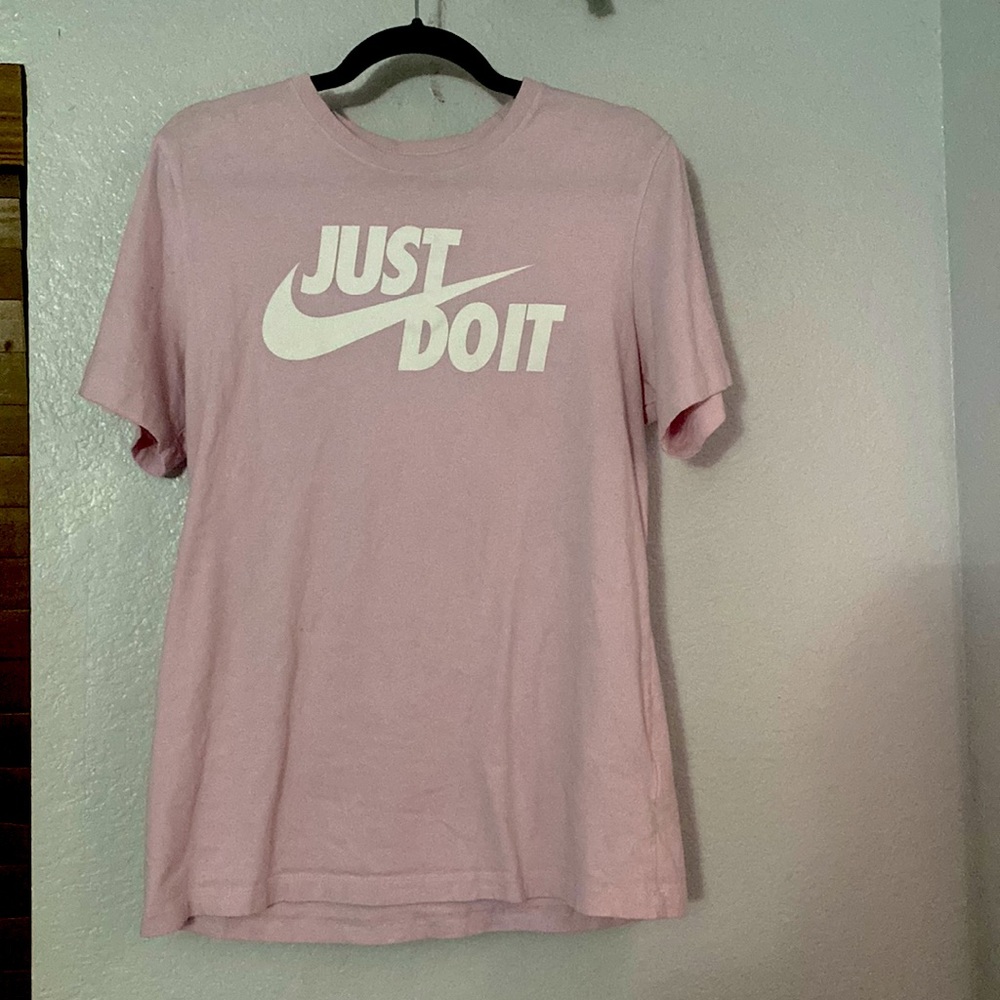 Medium soft pink Nike short sleeve shirt.
